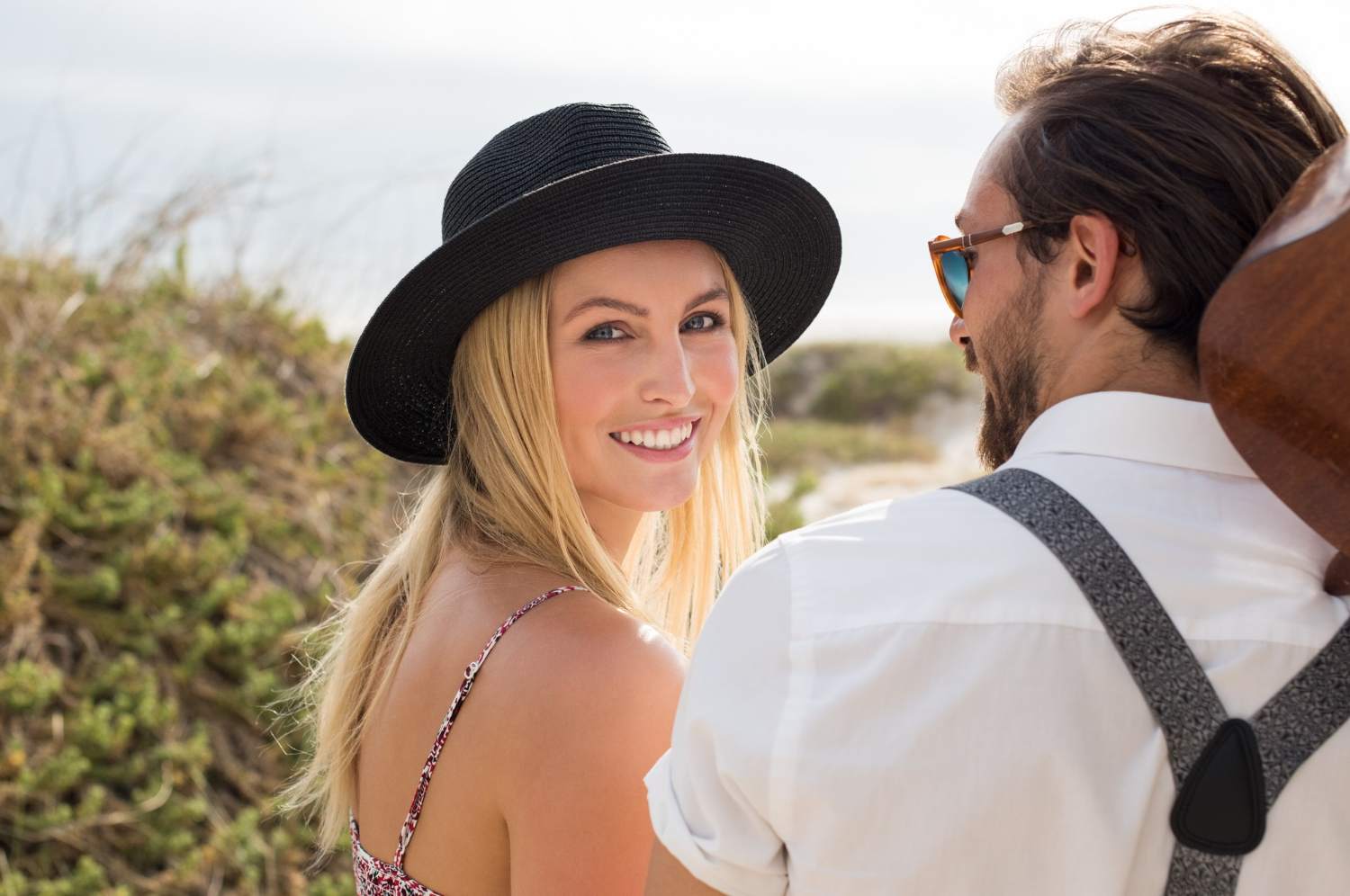 A confident young woman enjoying an outdoor date with a mature man