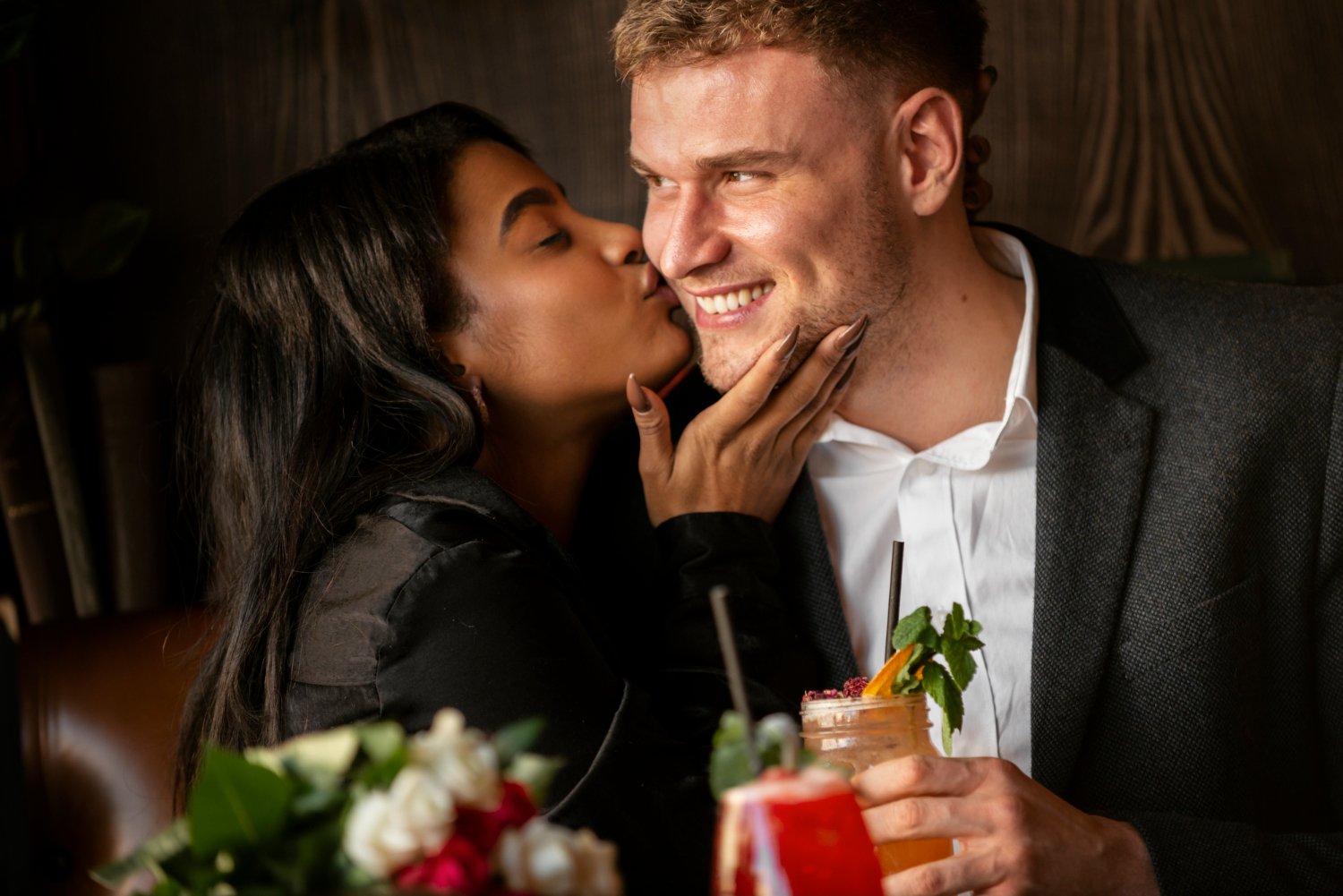 A couple sharing a warm moment together during a dinner date