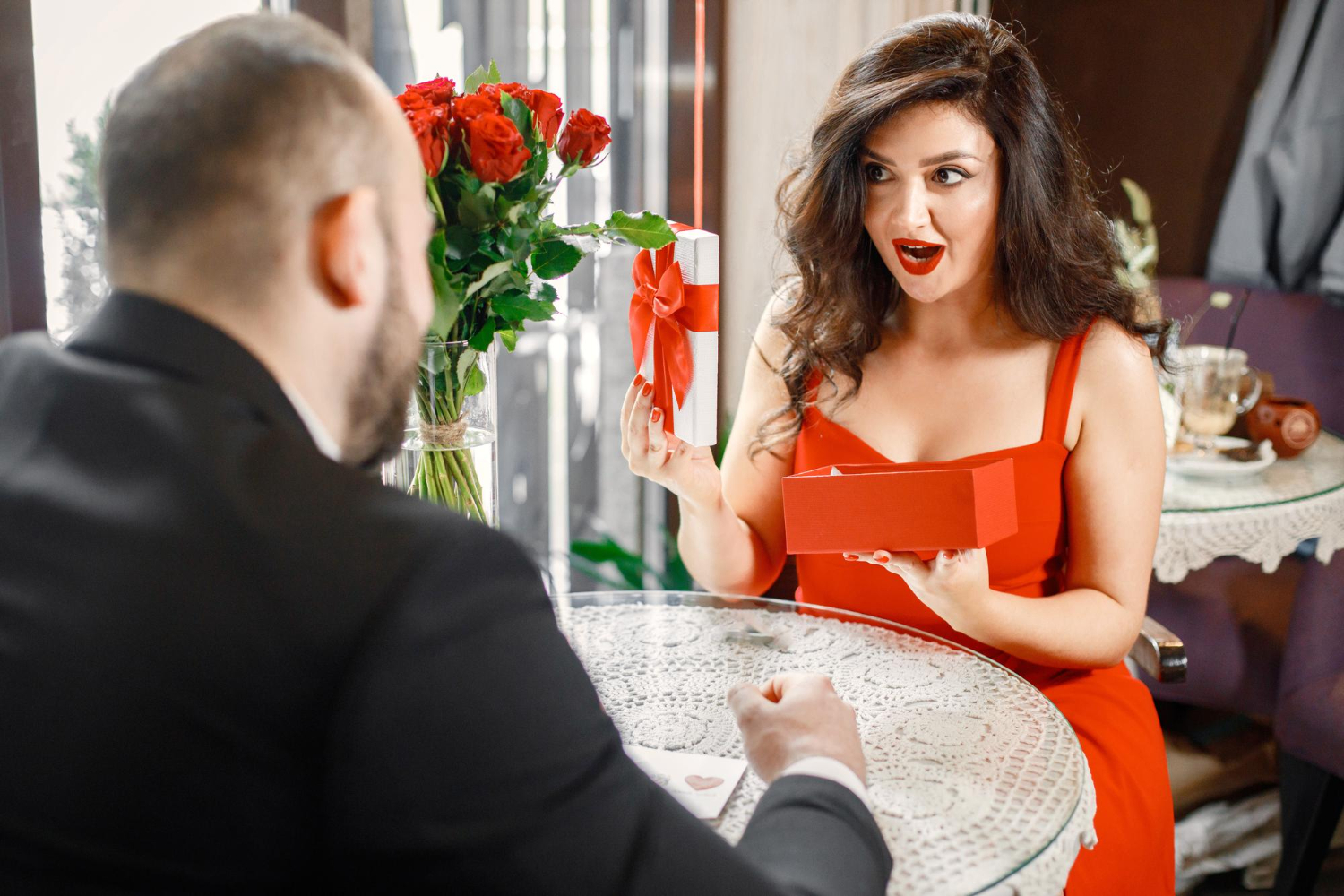 A woman receiving a thoughtful surprise during a date